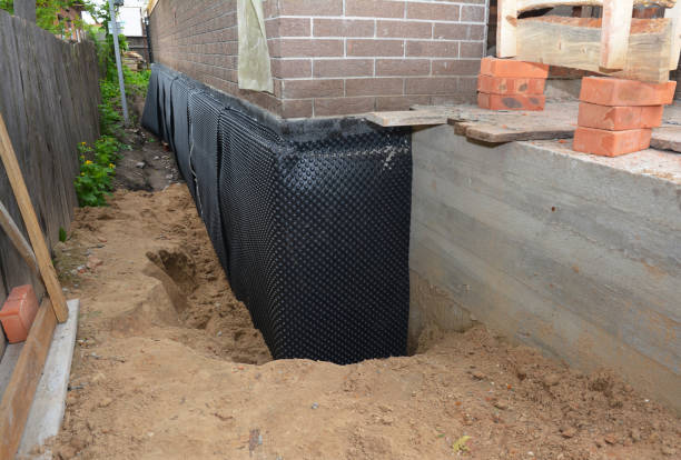 Happy homeowners after waterproofing job in Haysville